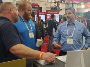 Jovan speaks with customers at NASCC 2025